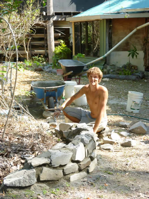 Freddie building a stone garden retaining wall
